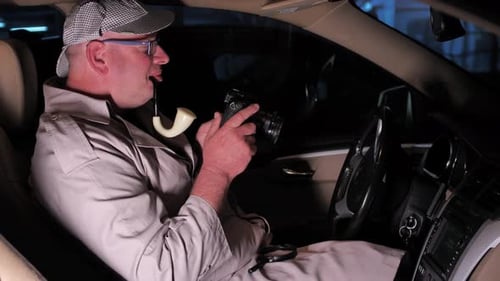 Funny detective dressed like Sherlock falls asleep in car waiting to take photo