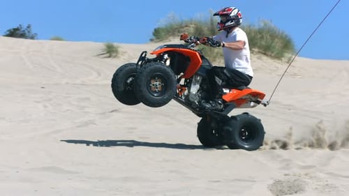 Riding Wheelie on a Quad,