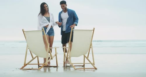 Beach, chair and happy couple holding hands, running and bond on relationship date