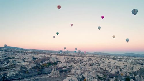 Hot Air Balloons Rise Over Cappadocia at Sunrise