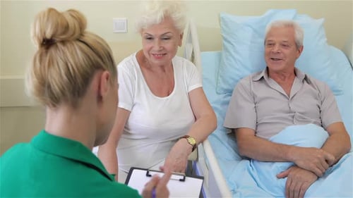 Nurse Notes the State of Health of Senior Male Patient