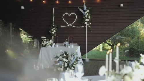 Wedding Reception Table Setting with Flowers and Candles