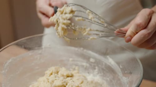 Mixing Dough in Bowl with Whisk and Hands