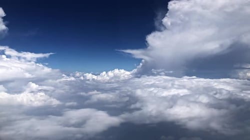 Fluffy Clouds and Blue Sky Aerial View