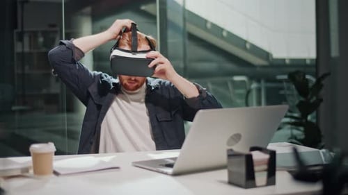 Futuristic Workflow Man Uses 3D Augmented Reality Glasses in Modern Office