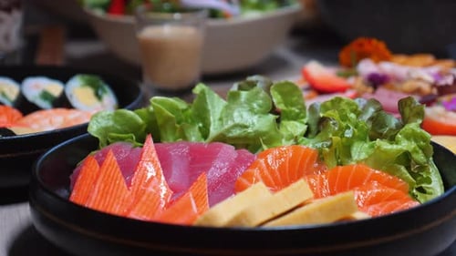 Colorful Assortment of Fresh Sashimi and Vegetable Salads Arranged on