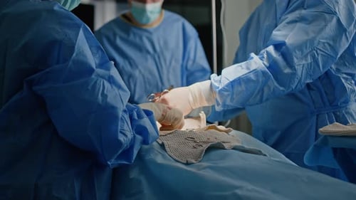 Surgeons Performing Operation in Hospital Operating Room