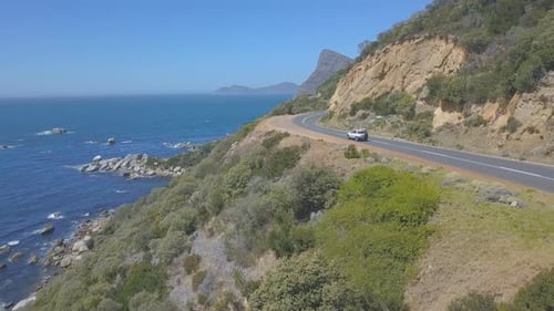 Aerial following car along coast in South Africa