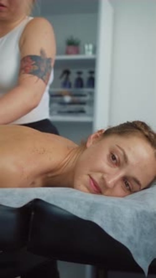 Young Slim and Beautiful Woman Gets Massage Therapy in Spa Salon Vertical Orientation Video