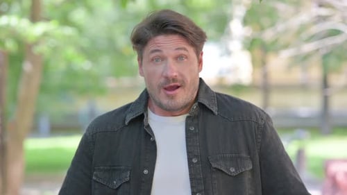 Man Clenches Fists in Celebration