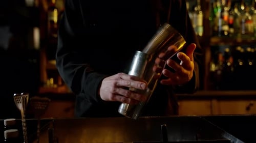 Bartender Shaking Cocktail with Expertise
