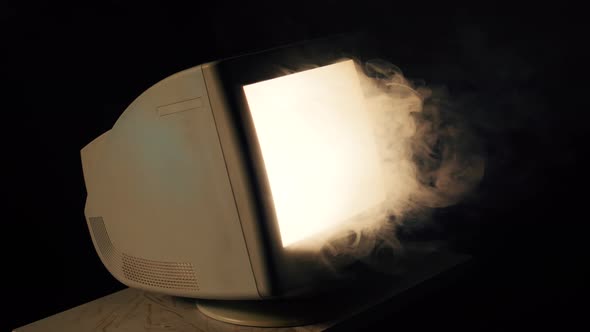 Glowing CRT Monitor Emitting Smoke in Dark Room, Technology Stock ...