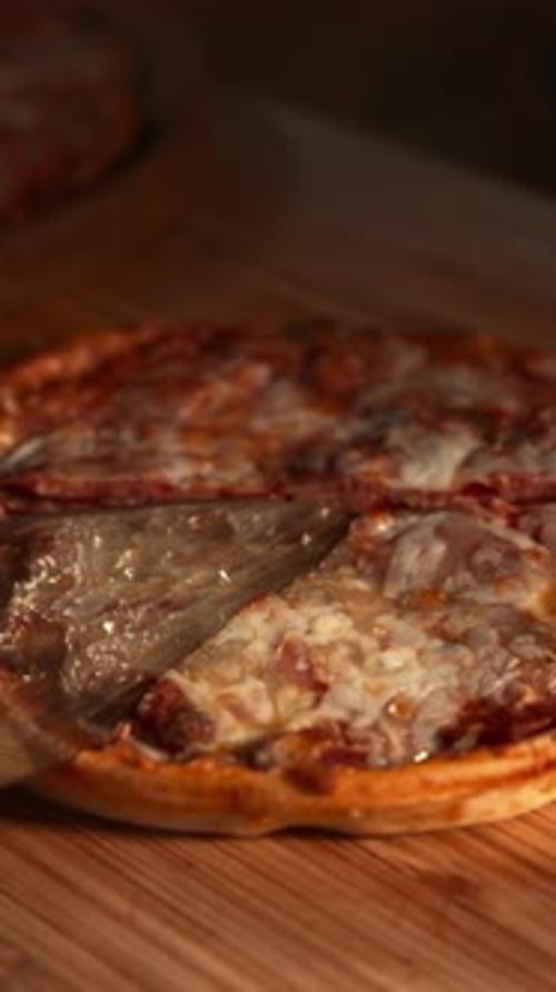 Delicious Pizza Cut into Slices on Wooden Board