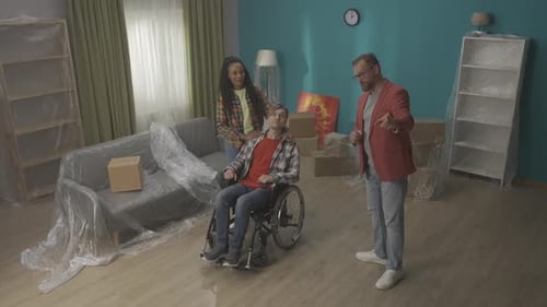 An African American Woman with a Man in a Wheelchair are Inspecting an Apartment for a Purchase The
