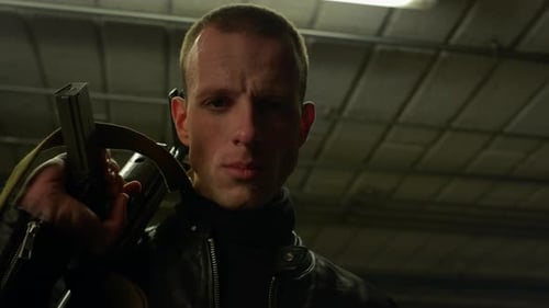 Man with rifle in dark underground parking garage