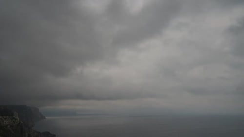 Timelapse Rainy Nimbostratus Clouds Moving in Bright Sunset Sky Over Stormy Sea Abstract Aerial