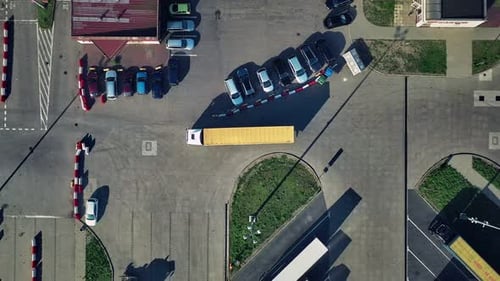 Trucks moving on the parking space at the ferry terminal.