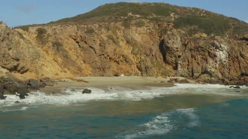 Aerial shot of beautiful beach with cliff. Ocean stock videos. drone view.