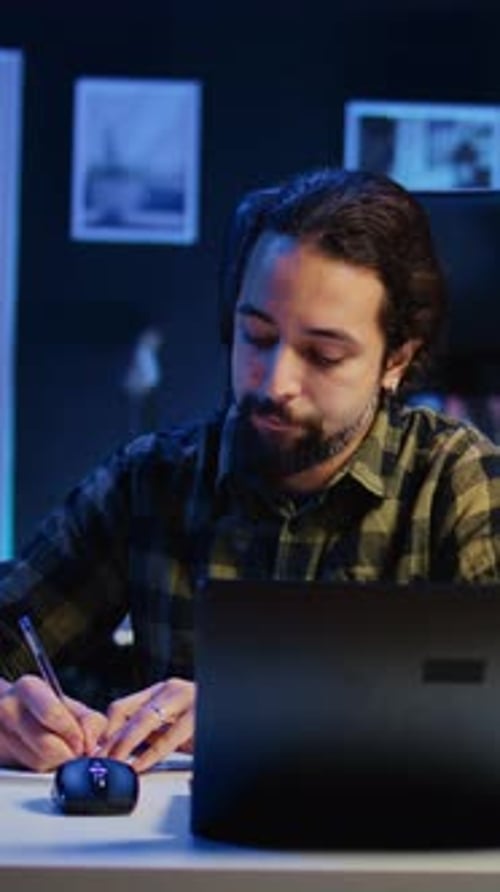 Vertical Video Freelancer Noting Down Ideas on Paper Using Pen While Teleworking