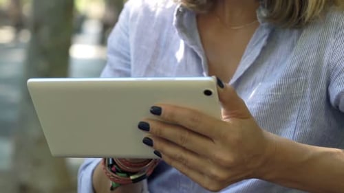 City Businesswoman on Tablet