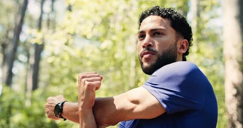 Man, fitness and stretching with arms in nature for workout preparation or health in forest