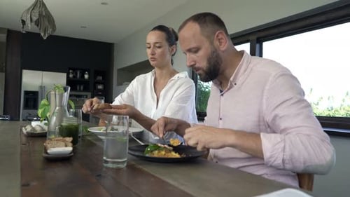 Couple Enjoying Healthy Meal Together at Home