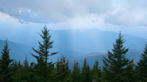 Couds Over Layered Mountain Landscape Moody Weather Scene with Misty Blue Ridges and Approaching