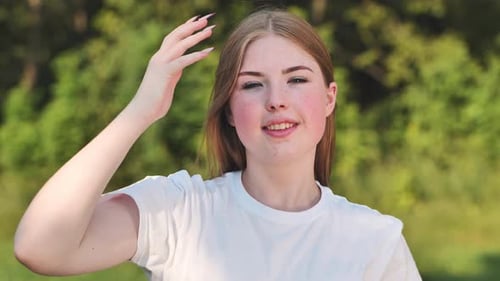 Portrait of a Young Schoolgirl in a Meadow