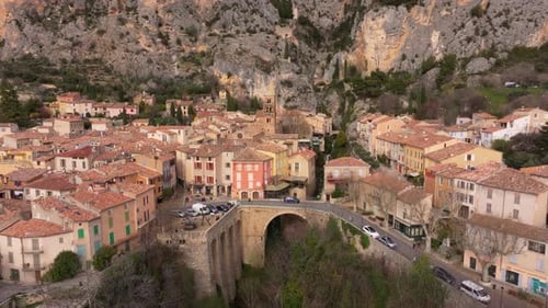 Aerial view of historic village in Provence surrounded by rugged hills