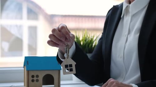 Real Estate Seller Woman Pass on Key for Buyer Customer Mortgage Rent Concept