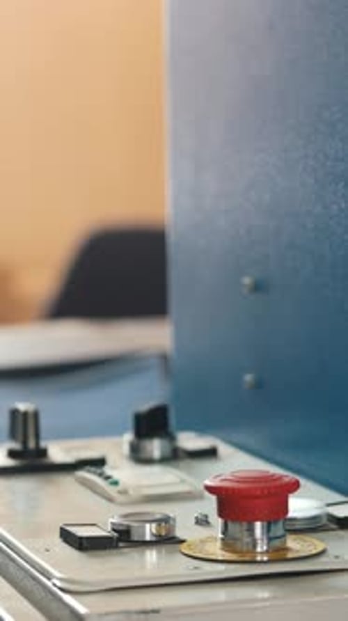 Red Button on Folding Machine Printing Polygraph Industry Close Up
