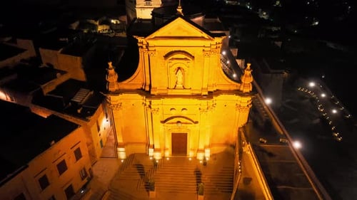 Aerial Night View Of Illuminated Cathedral In Malta