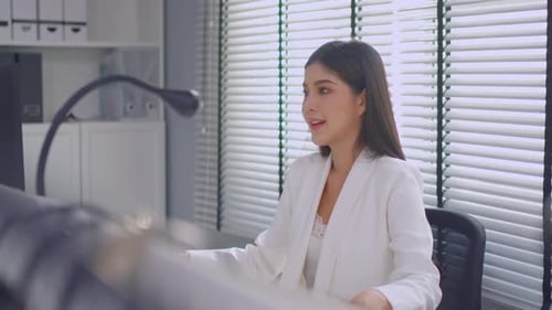 Asian beautiful businesswoman using laptop computer working in office.