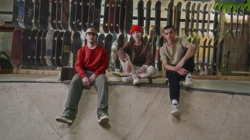 Group Portrait of Skateboarding Crew at Indoor Skatepark