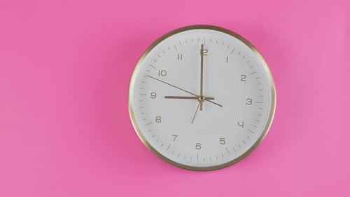 Clock Time Lapse on Pink Background