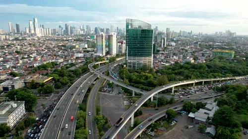 Aerial view of Jakarta highway traffic along central park mall