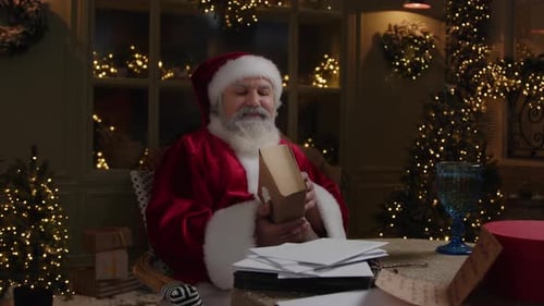 Santa Claus Reading Letters by Christmas Tree