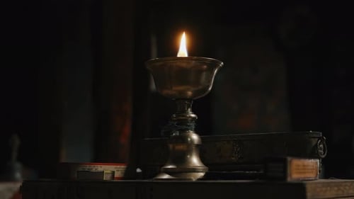 Brass Oil Lamp Burning in Buddhist Temple