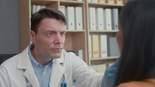 Doctor Examining Patient in Office Setting