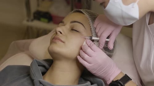 Young Woman Gets Facial Treatment Injection