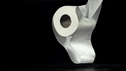 Toilet Paper Falls on the Table On a Black Background Filmed on a Highspeed Camera at 1000 Fps