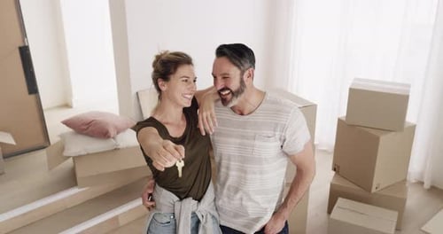 Happy Couple With Keys in New Home