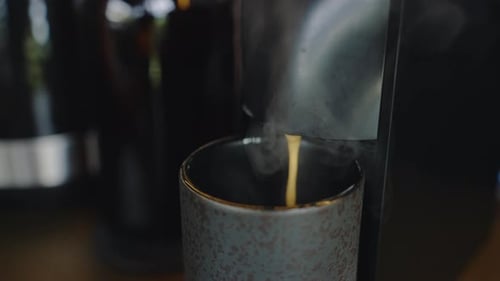 Coffee Being Dispensed into Mug from Modern Machine