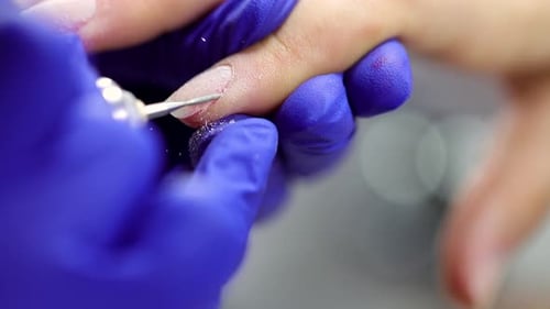 Hand Filing Nail With Tool Close Up