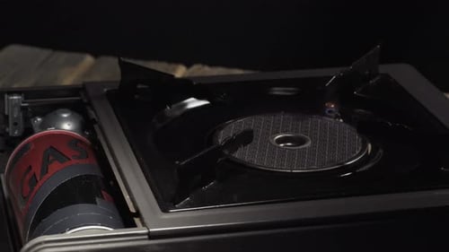 Portable gas ceramic hob for cooking, camping, turning on fire, close-up