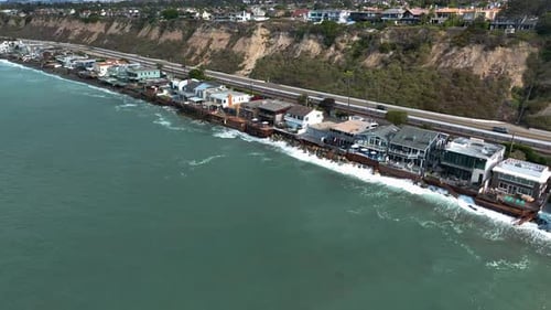 Drone circling villas on the coastline of San Clemente, sunny California, USA