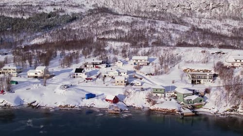 Snow Covered Mountain Range on Winter Coastline Norway Troms County Fjordgard