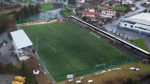 Team training football. Soccer field with players.
Aerial view of a football field. Team playing soc