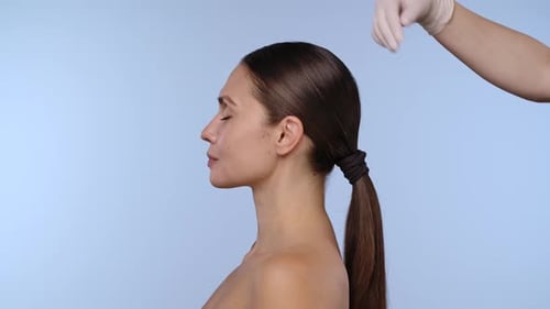 Woman Having Cosmetic Medical Procedure on Face