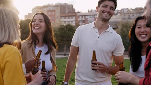 Friends Enjoying Drinks and Conversation Outdoors
